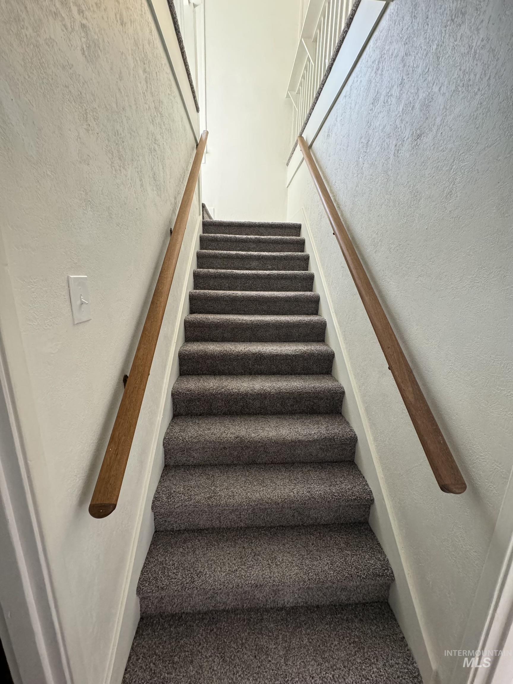 729 Morgan Avenue Ontario, OR 97914 - Photo 30 of 49 Staircase featuring carpet flooring and a textured wall