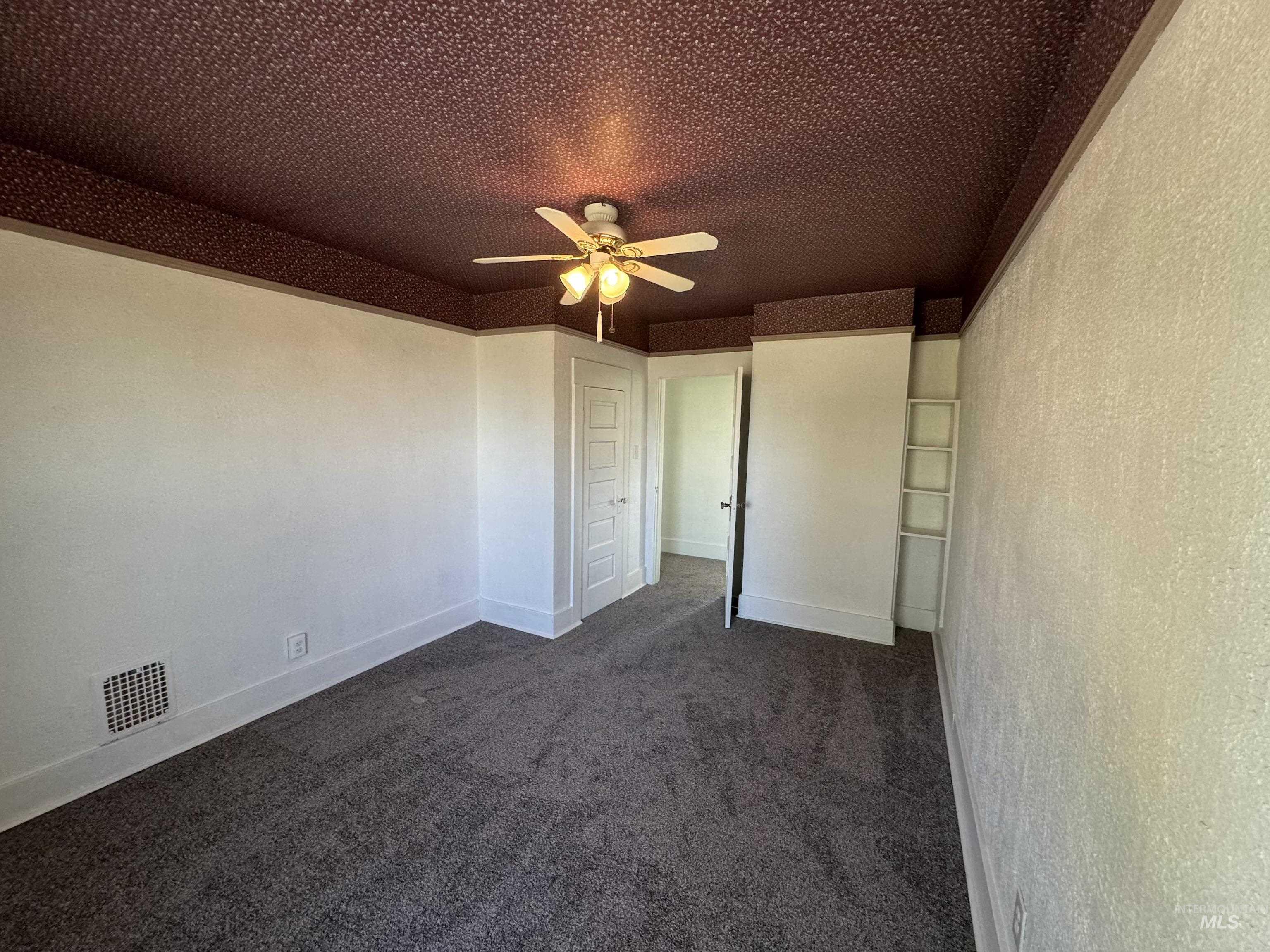 729 Morgan Avenue Ontario, OR 97914 - Photo 41 of 49 Unfurnished bedroom with dark colored carpet and ceiling fan