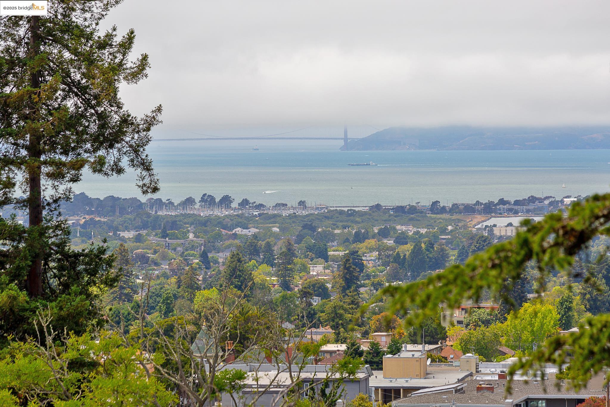 1542 Hawthorne Terrace Berkeley, CA 94708 - Photo 11 of 26 an aerial view of a city with lots of residential buildings and ocean view in back