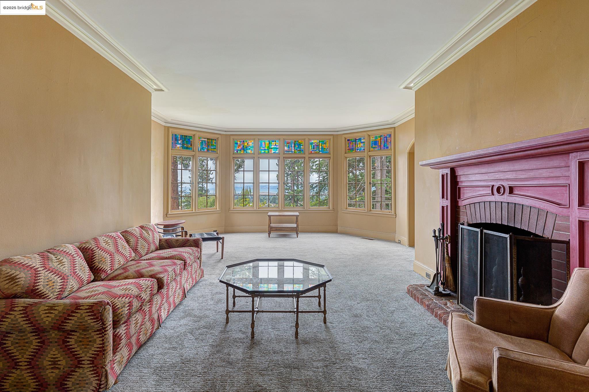 1542 Hawthorne Terrace Berkeley, CA 94708 - Photo 6 of 26 a living room with furniture a fireplace and a large window