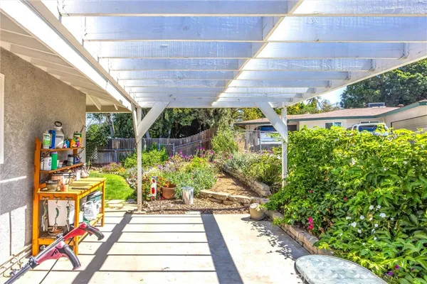 a view of yard with patio