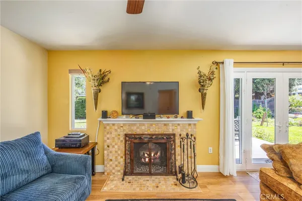a living room with furniture and a fireplace