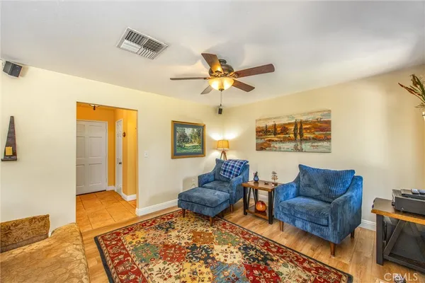 a living room with furniture and a rug