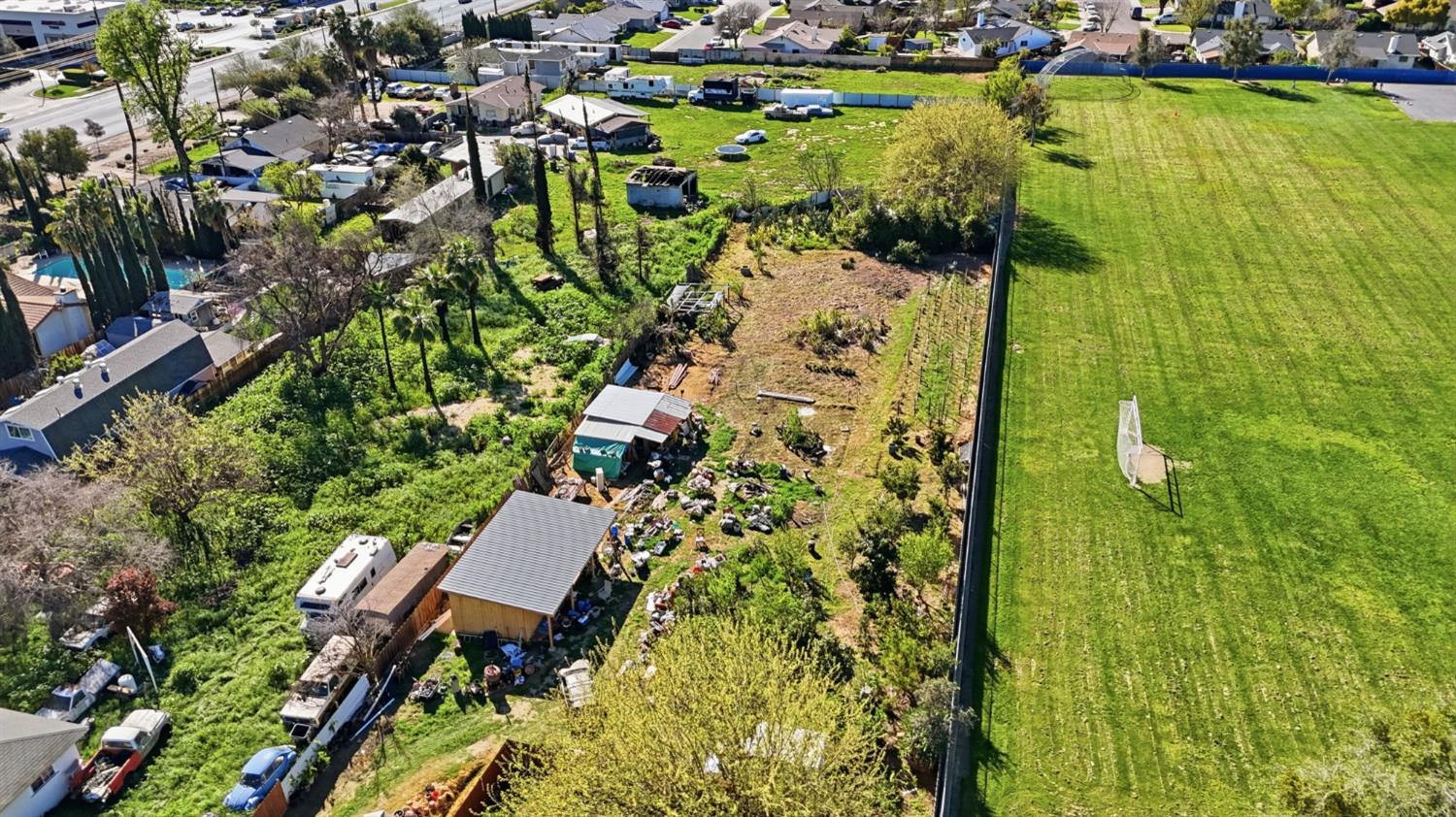 1409 Stonum Road Modesto, CA 95351 - Photo 35 of 40 an aerial view of residential house with swimming pool and lawn chairs