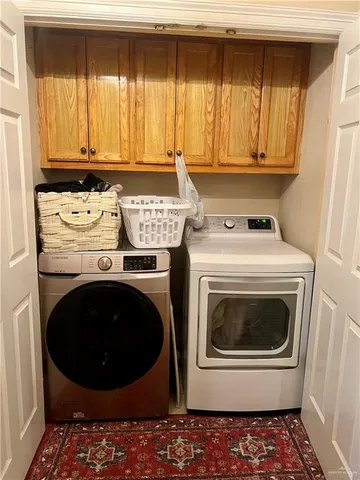a view of cabinets and wooden floor