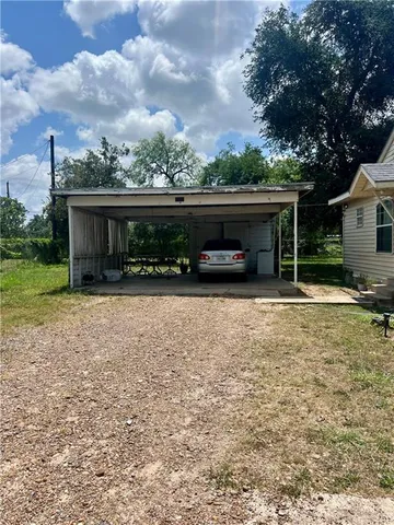 a view of a yard with tree s