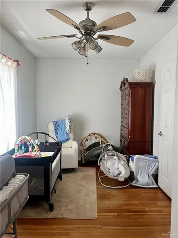a bathroom with a toilet a sink and a mirror