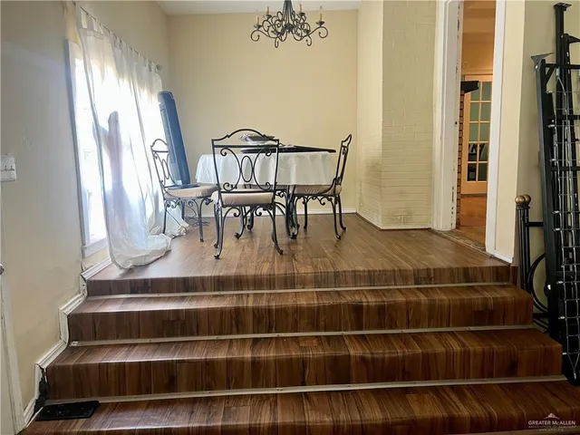 a living room with furniture and flowers