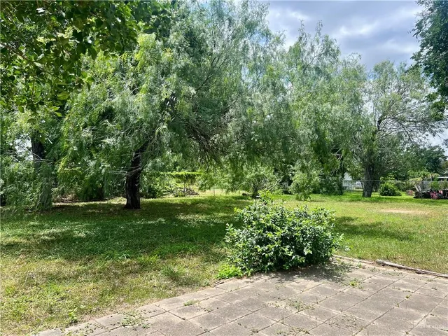 a view of outdoor space with deck and yard