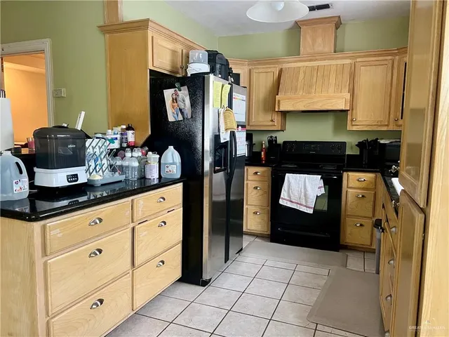 a kitchen with sink cabinets and appliances