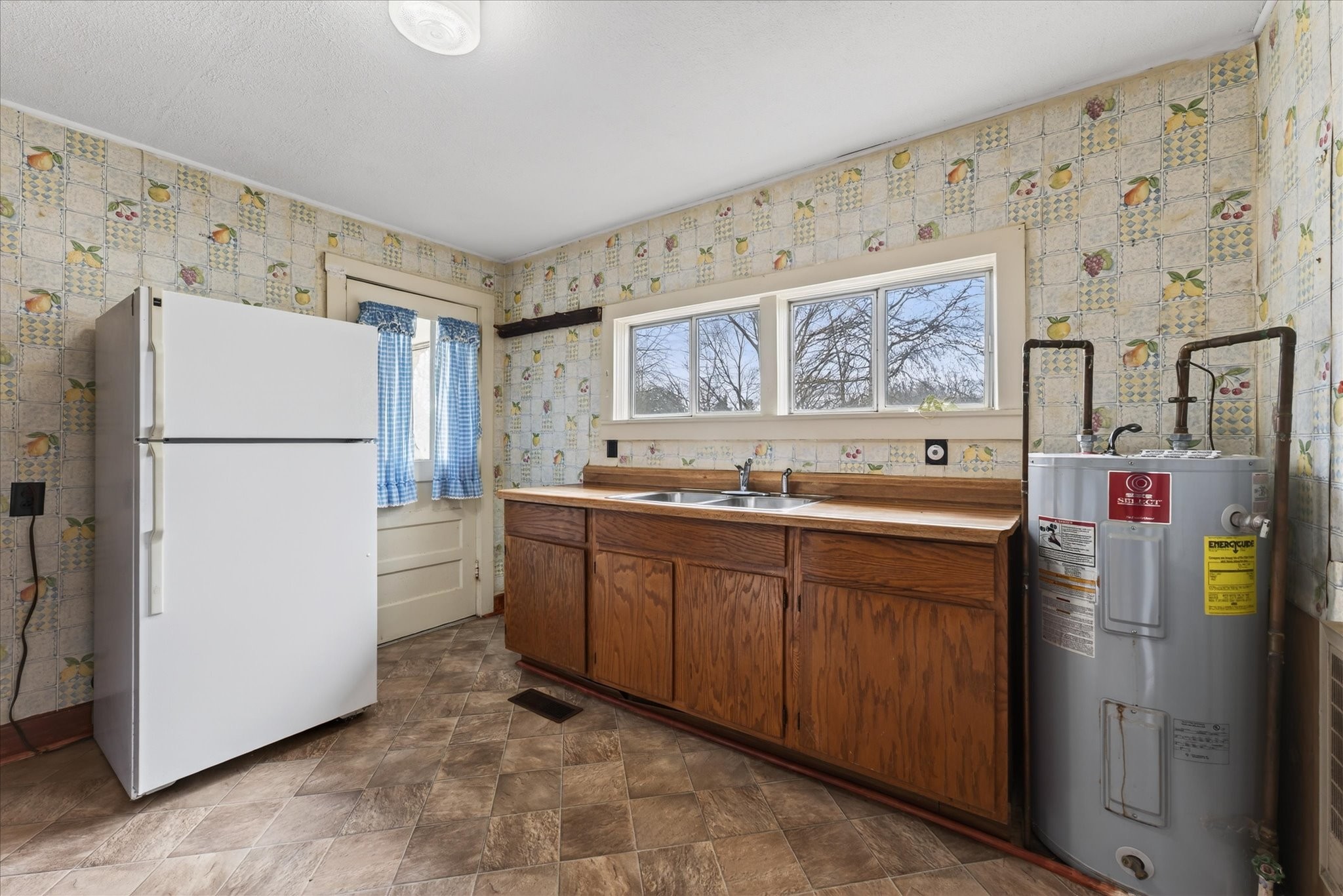 3236 Dover Road Woodlawn, TN 37191 - Photo 11 of 38 a kitchen with stainless steel appliances granite countertop a refrigerator and a sink