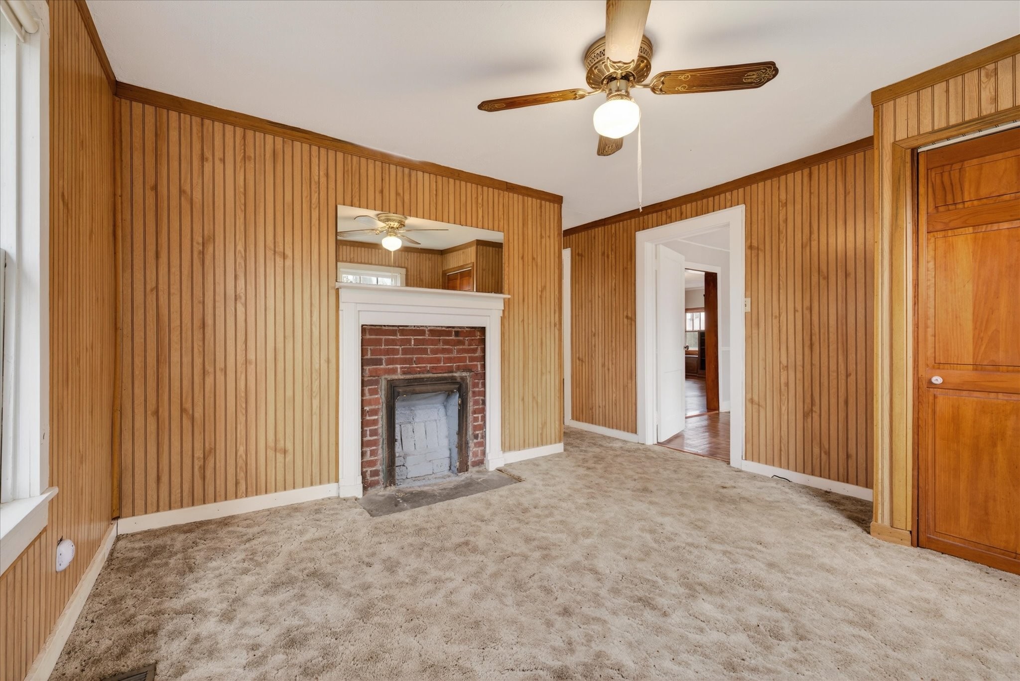 3236 Dover Road Woodlawn, TN 37191 - Photo 15 of 38 a view of a livingroom with a chandelier fan and a fireplace