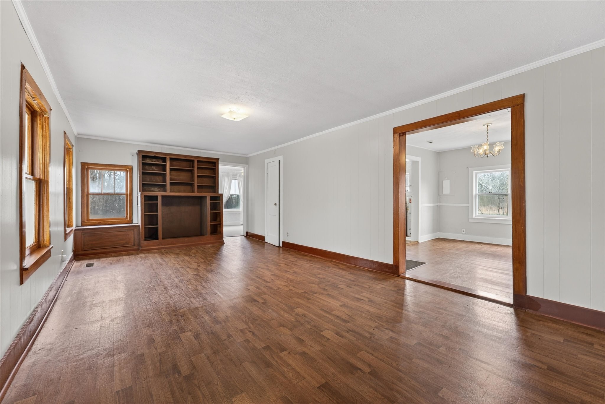 3236 Dover Road Woodlawn, TN 37191 - Photo 5 of 38 an empty room with wooden floor and windows