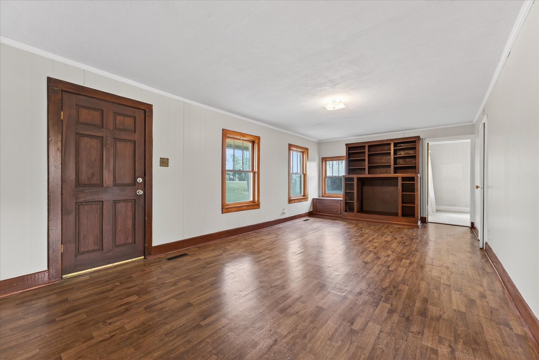 3236 Dover Road Woodlawn, TN 37191 - Photo 7 of 38 a view of empty room with wooden floor and window