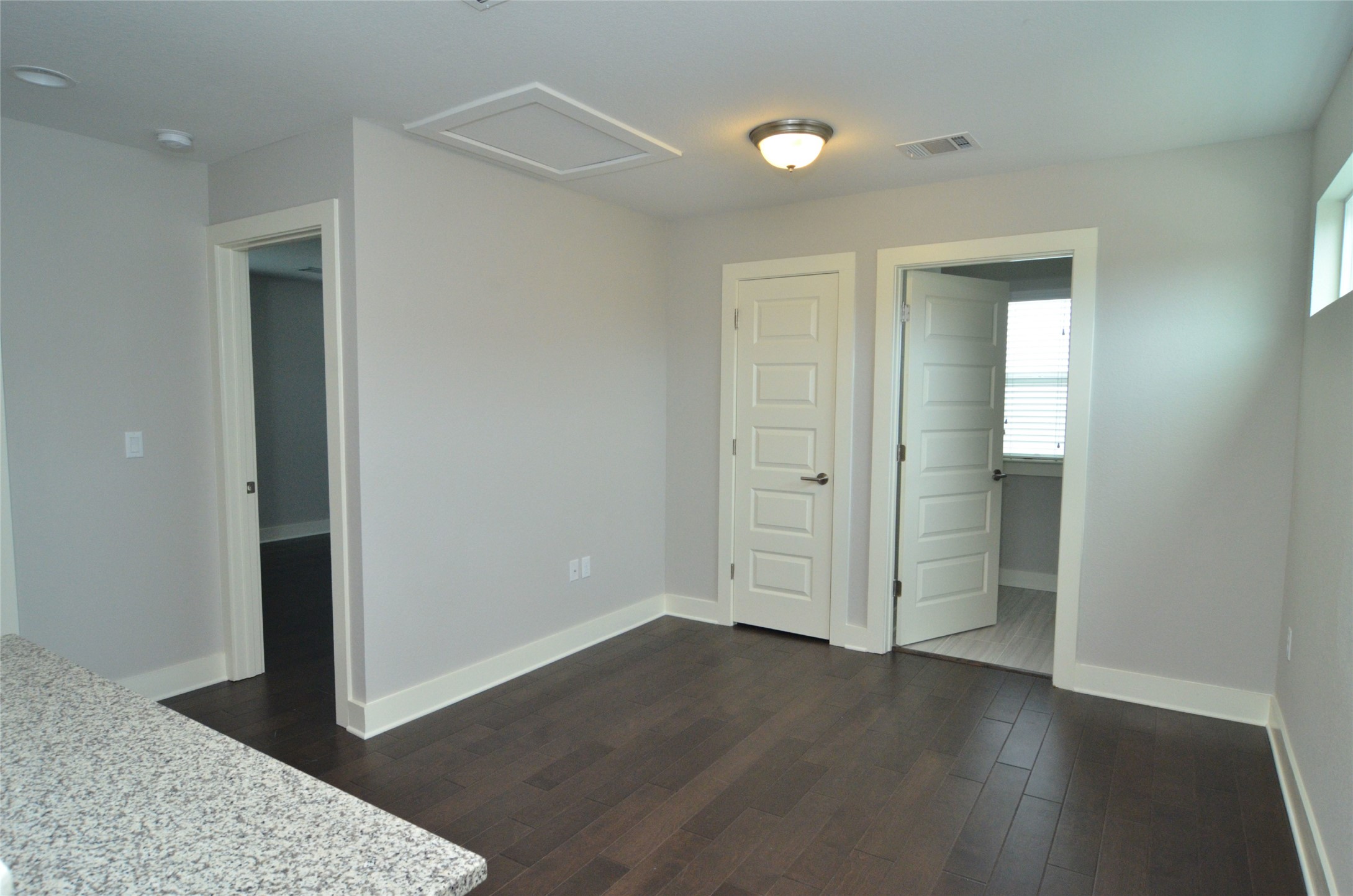 1916 Cleese Drive Austin, TX 78741 - Photo 17 of 36 Warm wood-look flooring and clean architectural lines define this versatile interior space.