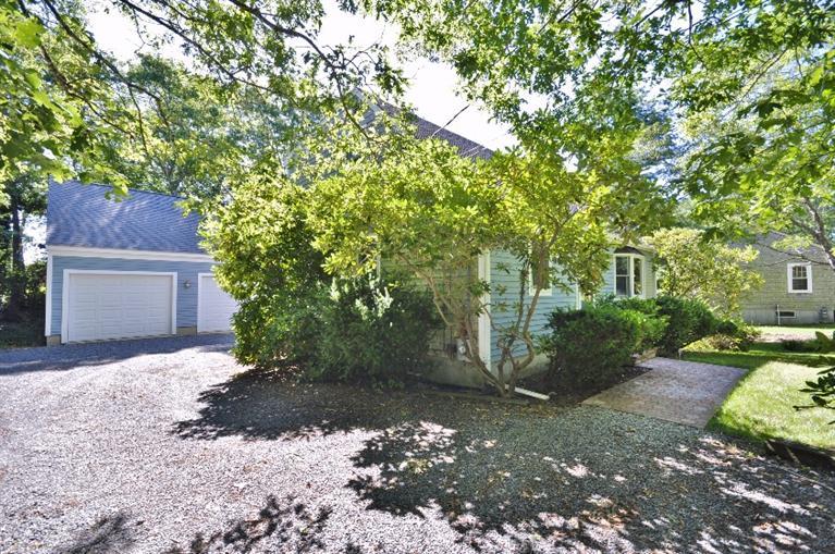 58 Norris Road Sagamore Beach, MA 02562 - Photo 28 of 32 a backyard of a house with lots of green space