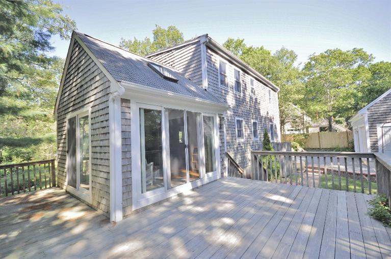 58 Norris Road Sagamore Beach, MA 02562 - Photo 3 of 32 a view of a house with a yard and wooden floor