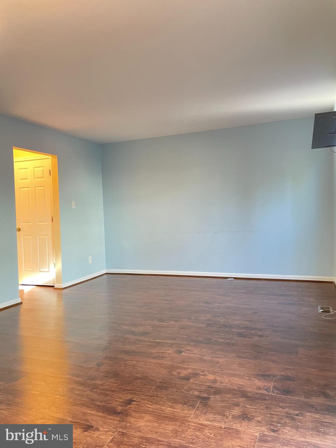 12405 Gooderham Way Gaithersburg, MD 20878 - Photo 12 of 31 a view of an empty room and wooden floor