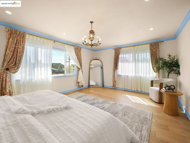 a bedroom with a large bed and a window