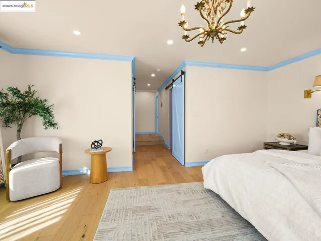 a bedroom with a bed and a couch