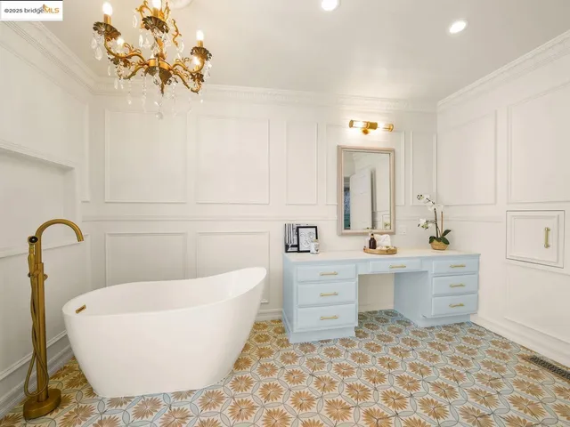 a spacious bathroom with a bathtub and a sink