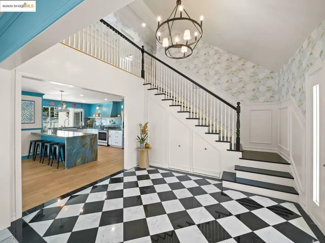 a view of entryway and hall with a rug