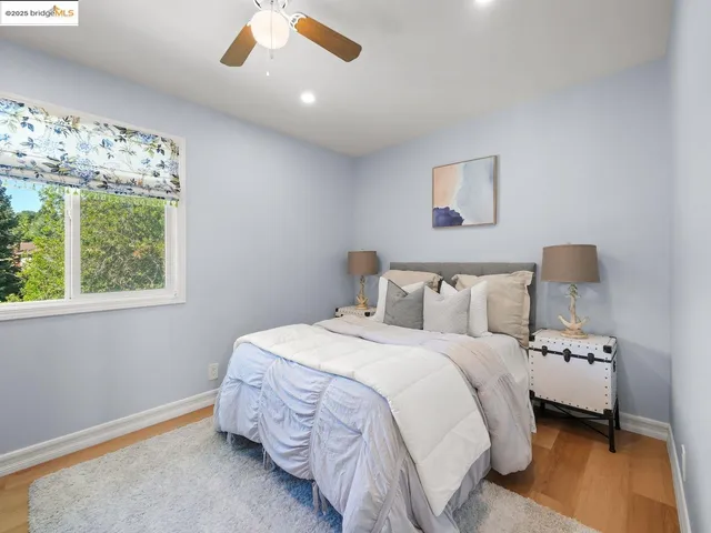 a bedroom with bed and a window