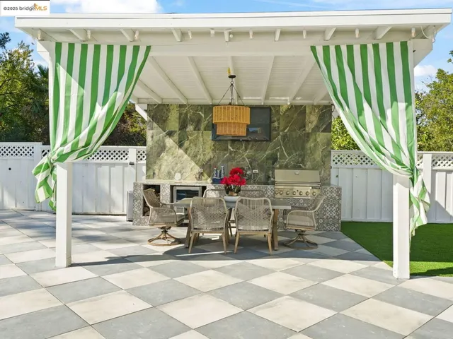 a view of a tennis court with sitting area