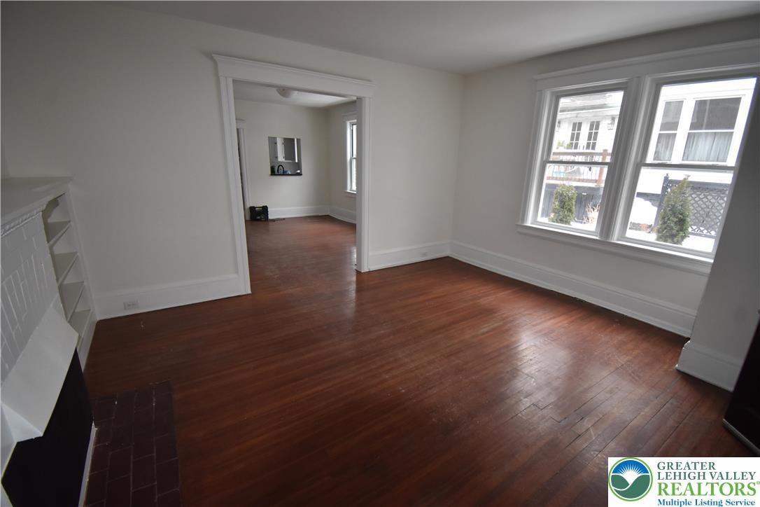 312 March Street, Unit 2 Easton, PA 18042 - Photo 4 of 10 a view of an empty room with wooden floor and a window