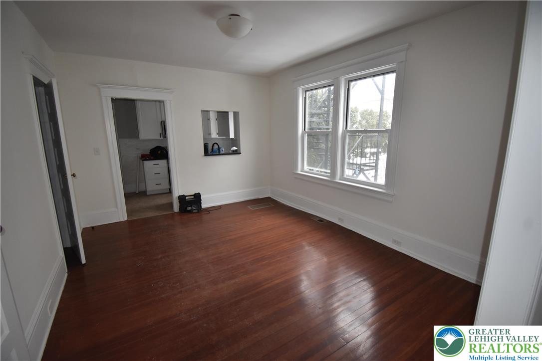 312 March Street, Unit 2 Easton, PA 18042 - Photo 5 of 10 a view of an empty room with wooden floor and a window