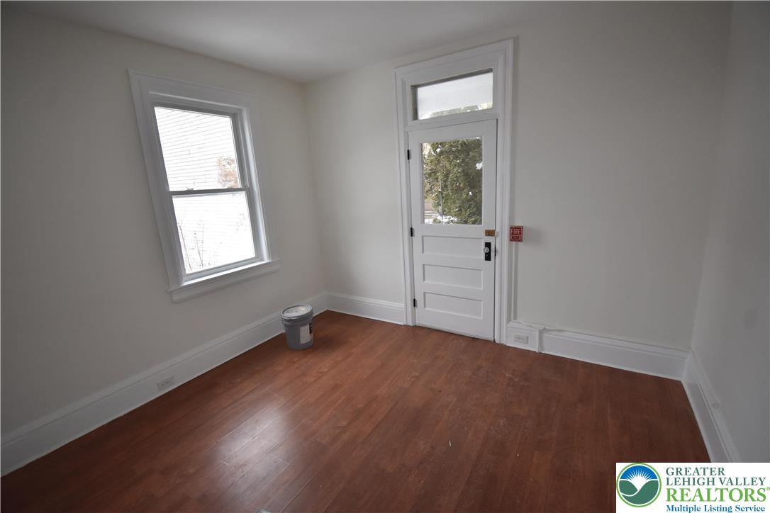 312 March Street, Unit 2 Easton, PA 18042 - Photo 9 of 10 an empty room with wooden floor closet and windows