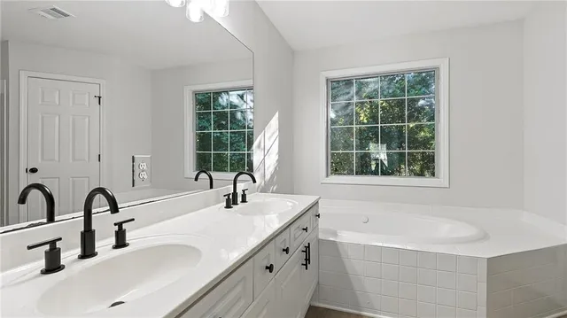 a view of a house with a yard and garage