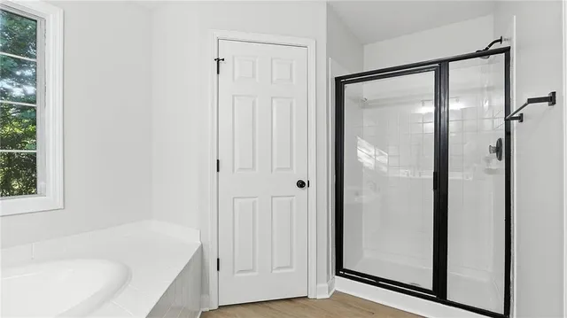 a view of a backyard with a garden and entertaining space