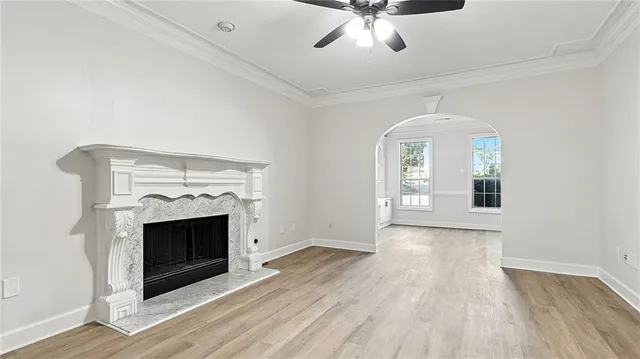 wooden floor fireplace and windows in a room