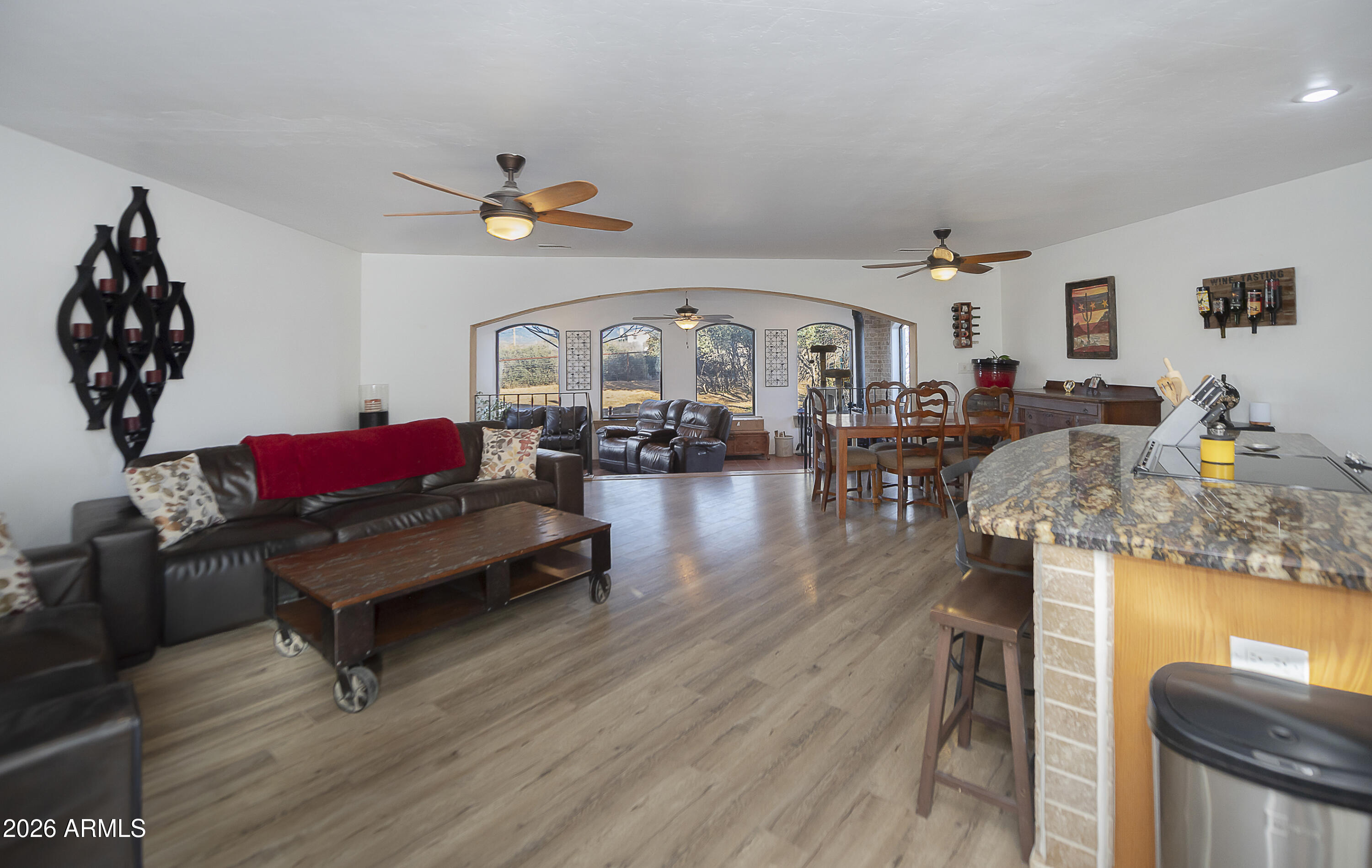 6565 Musgrove Road Skull Valley, AZ 86338 - Photo 11 of 67 a living room with furniture and wooden floor