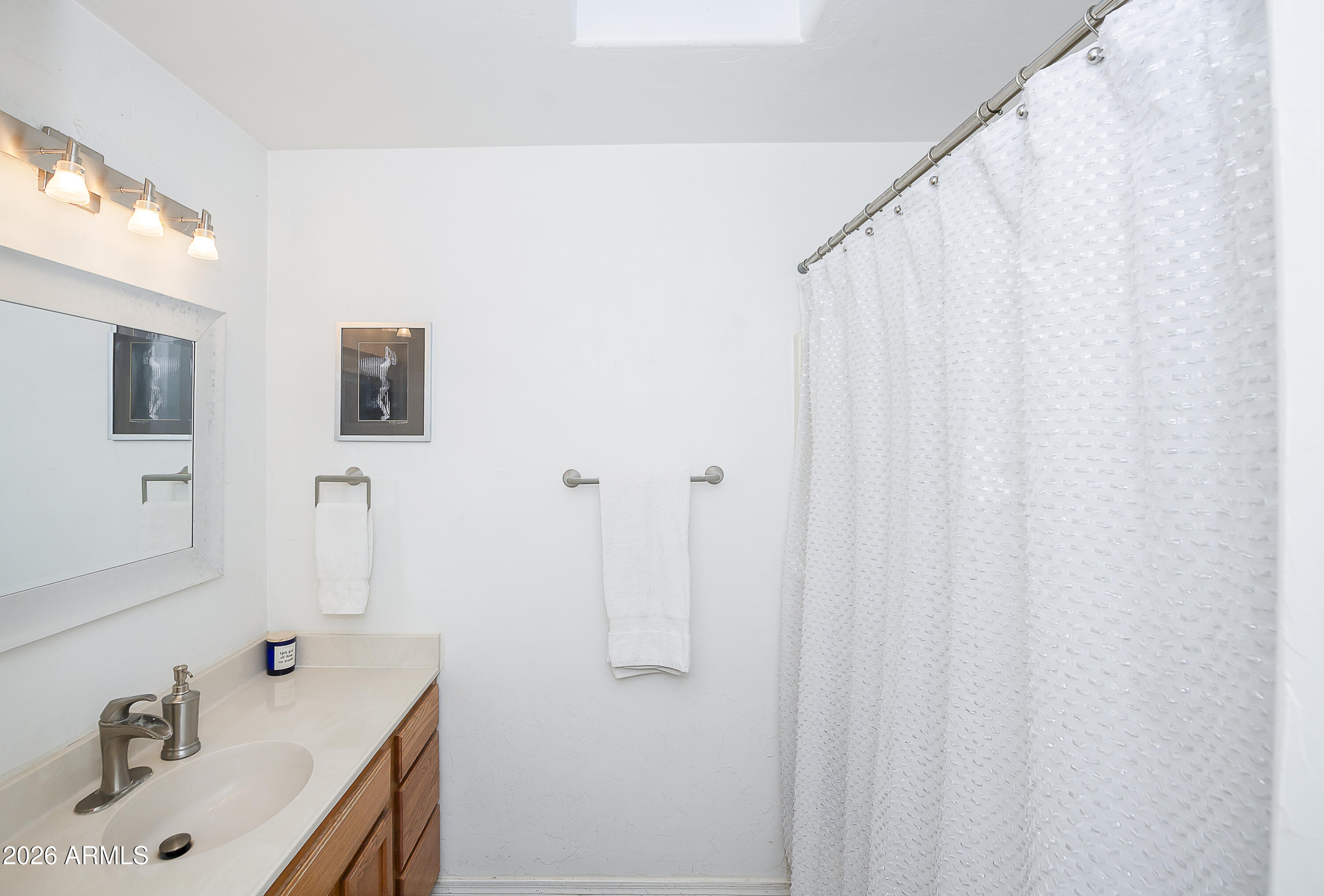6565 Musgrove Road Skull Valley, AZ 86338 - Photo 23 of 67 a bathroom with a sink and a tub