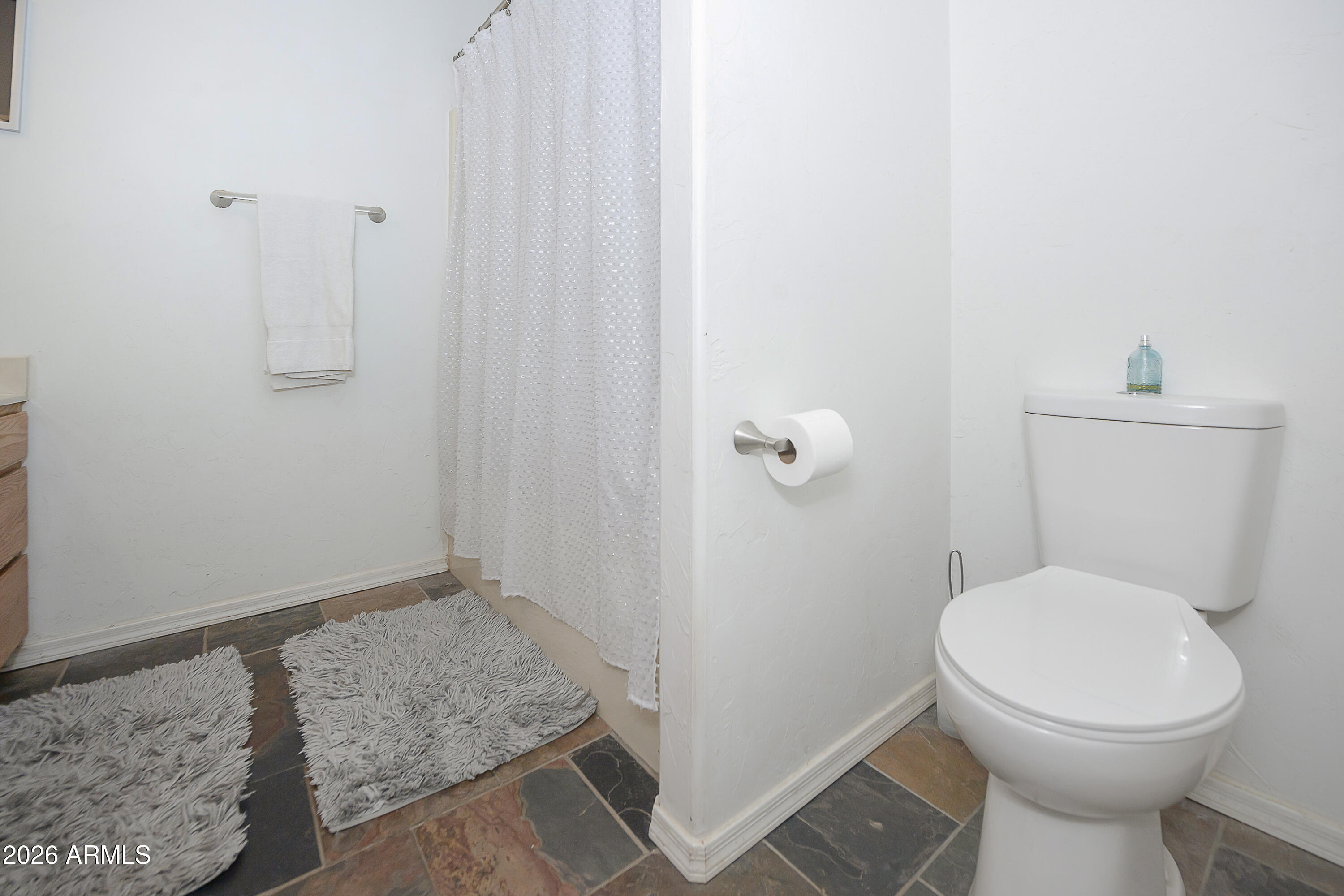 6565 Musgrove Road Skull Valley, AZ 86338 - Photo 25 of 67 a bathroom with a toilet and a shower