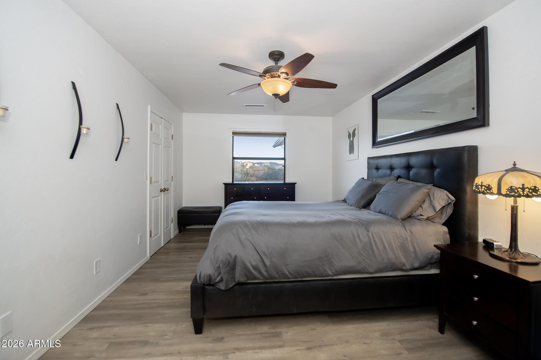 6565 Musgrove Road Skull Valley, AZ 86338 - Photo 28 of 67 a bedroom with a bed and window