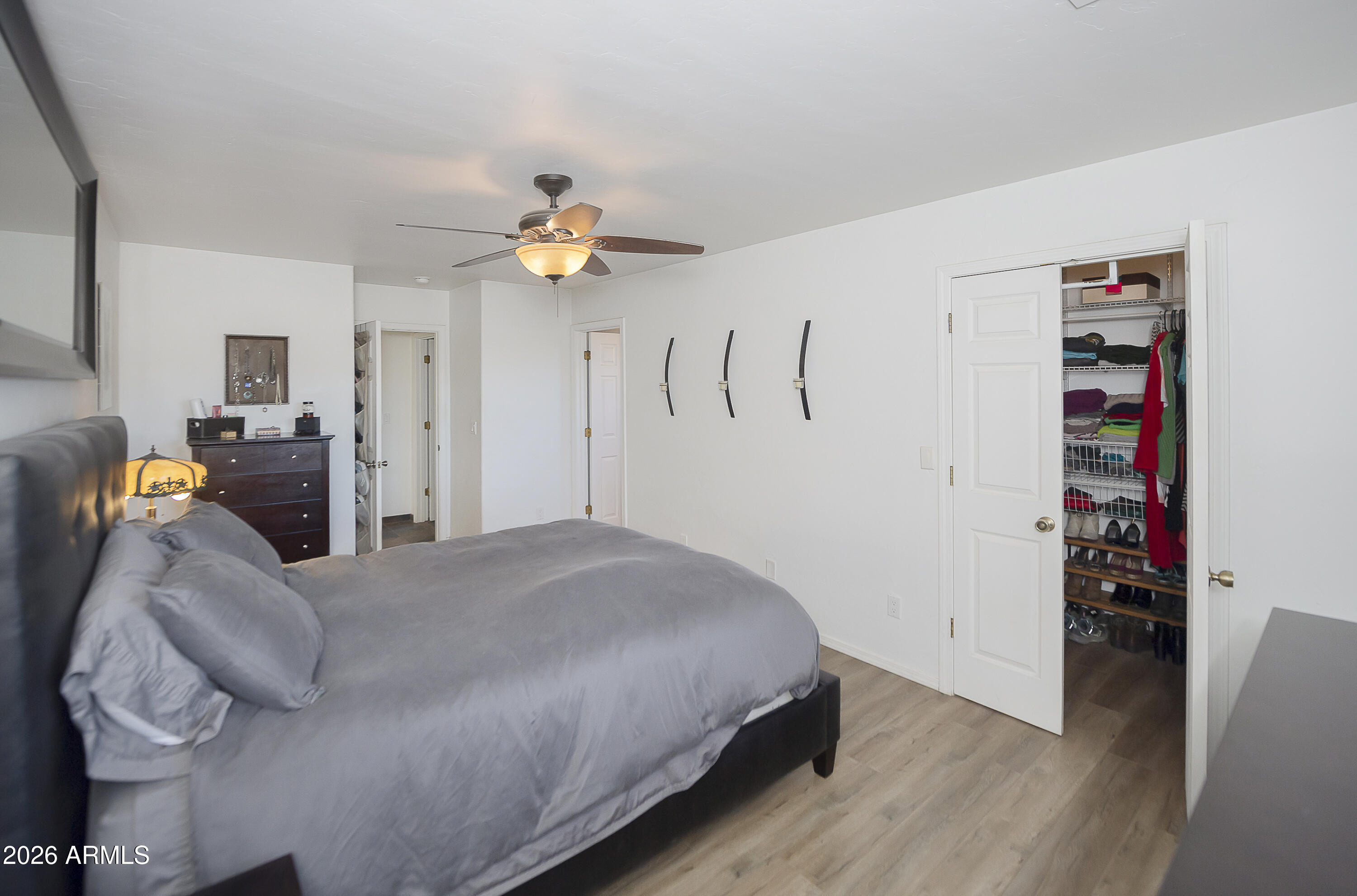 6565 Musgrove Road Skull Valley, AZ 86338 - Photo 29 of 67 a bedroom with a bed and a chandelier