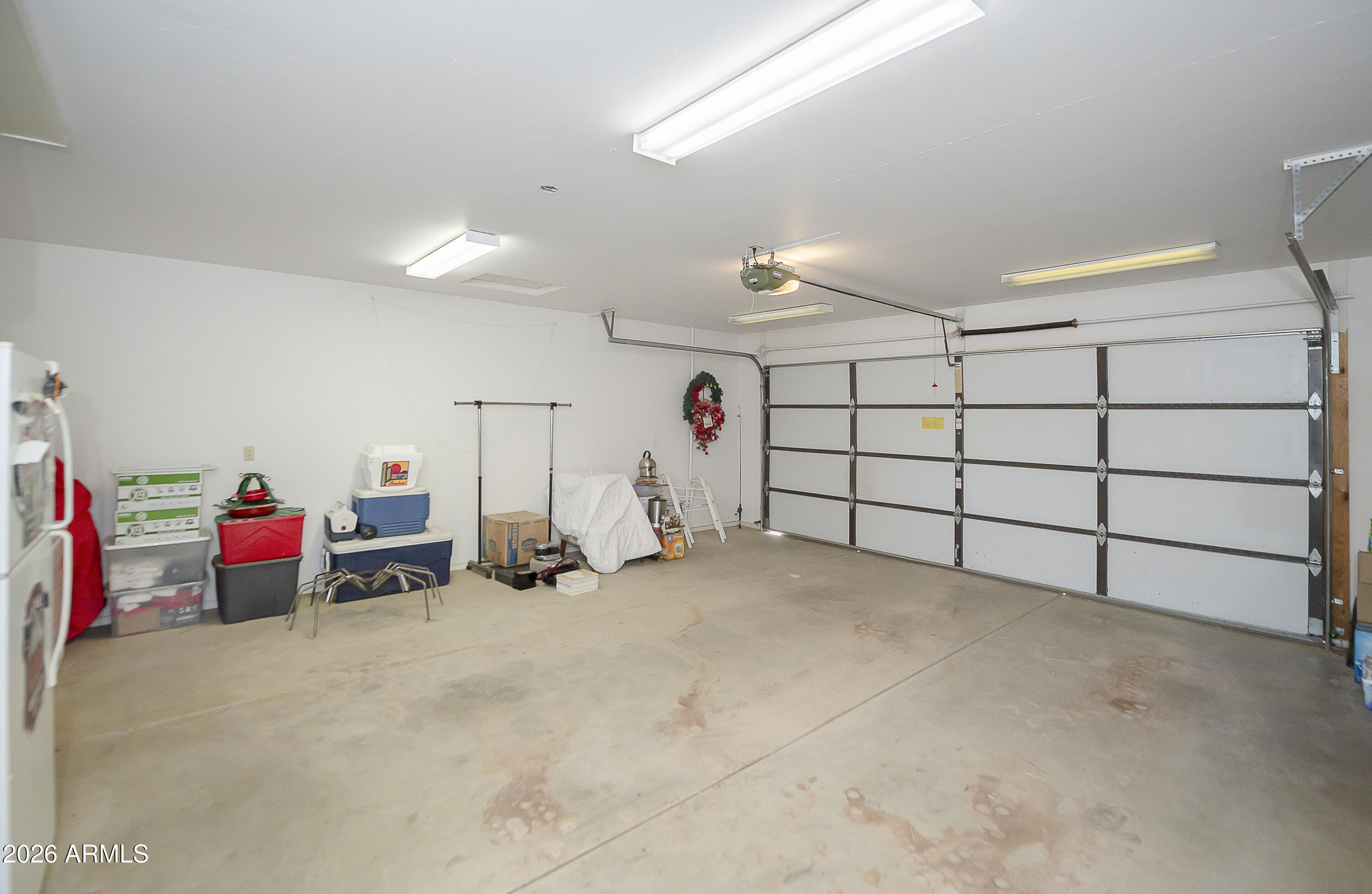 6565 Musgrove Road Skull Valley, AZ 86338 - Photo 34 of 67 a view of a garage with rack and white walls