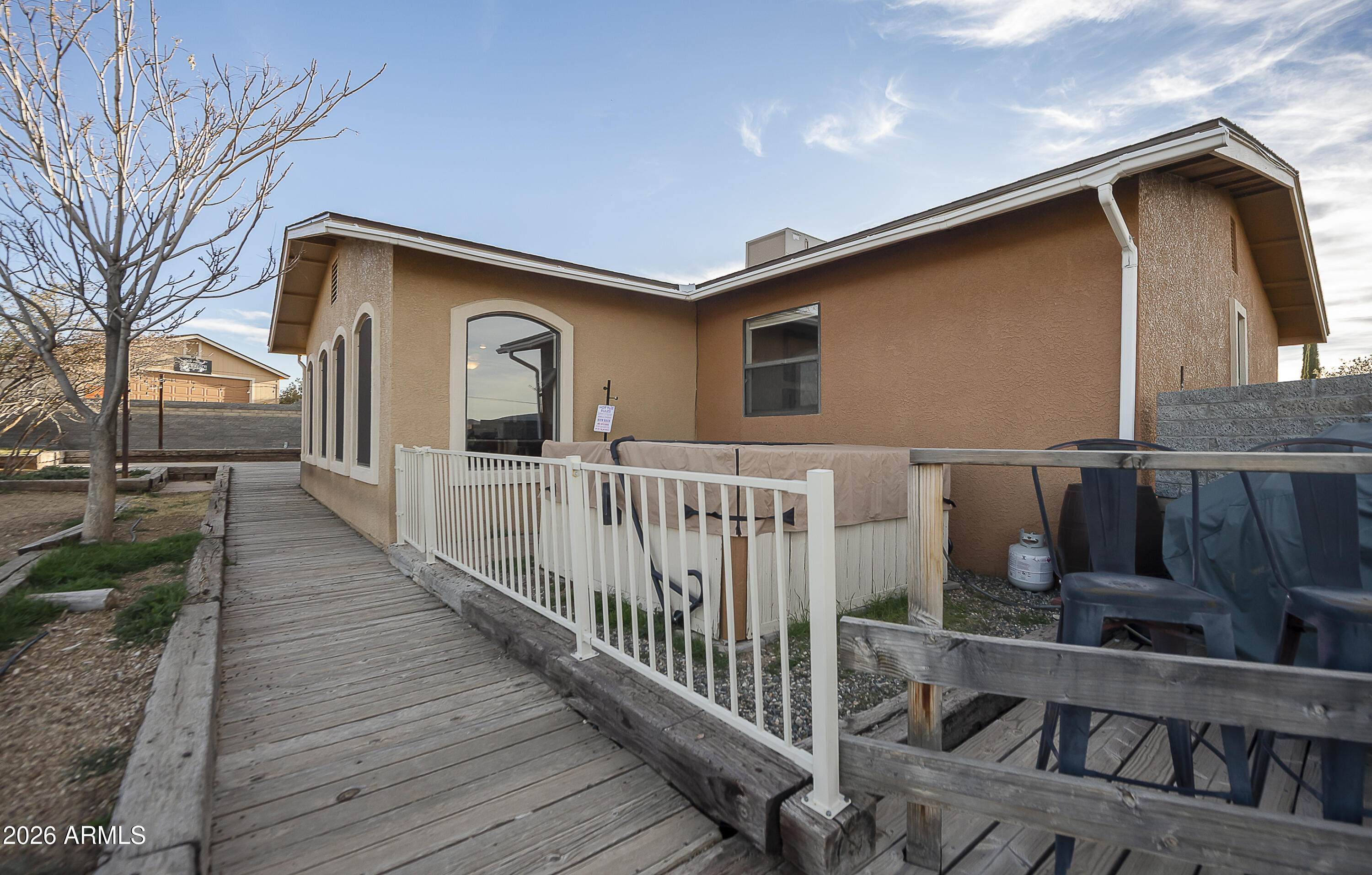 6565 Musgrove Road Skull Valley, AZ 86338 - Photo 44 of 67 a view of a house with wooden fence