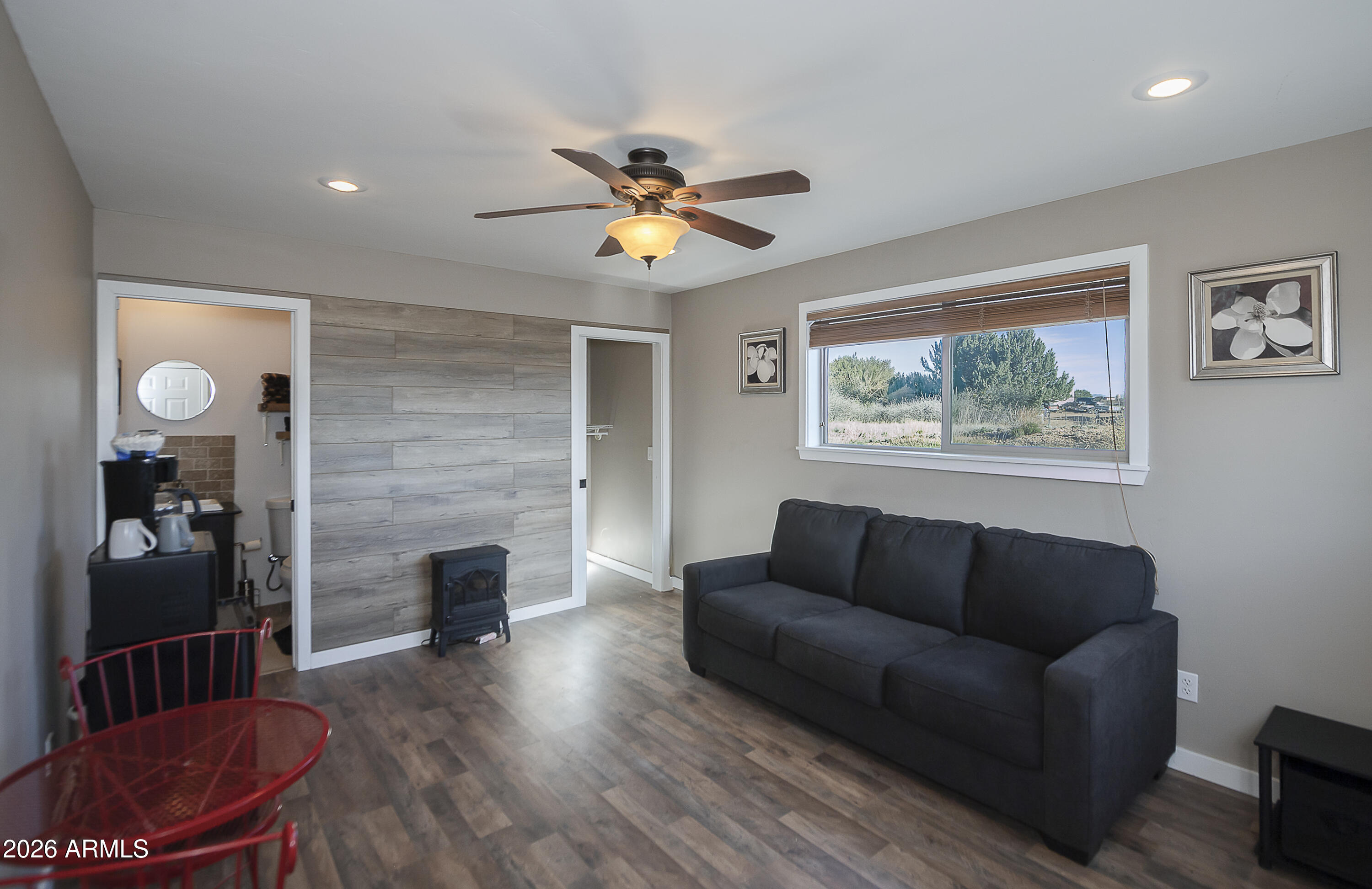 6565 Musgrove Road Skull Valley, AZ 86338 - Photo 52 of 67 a living room with furniture and a fireplace