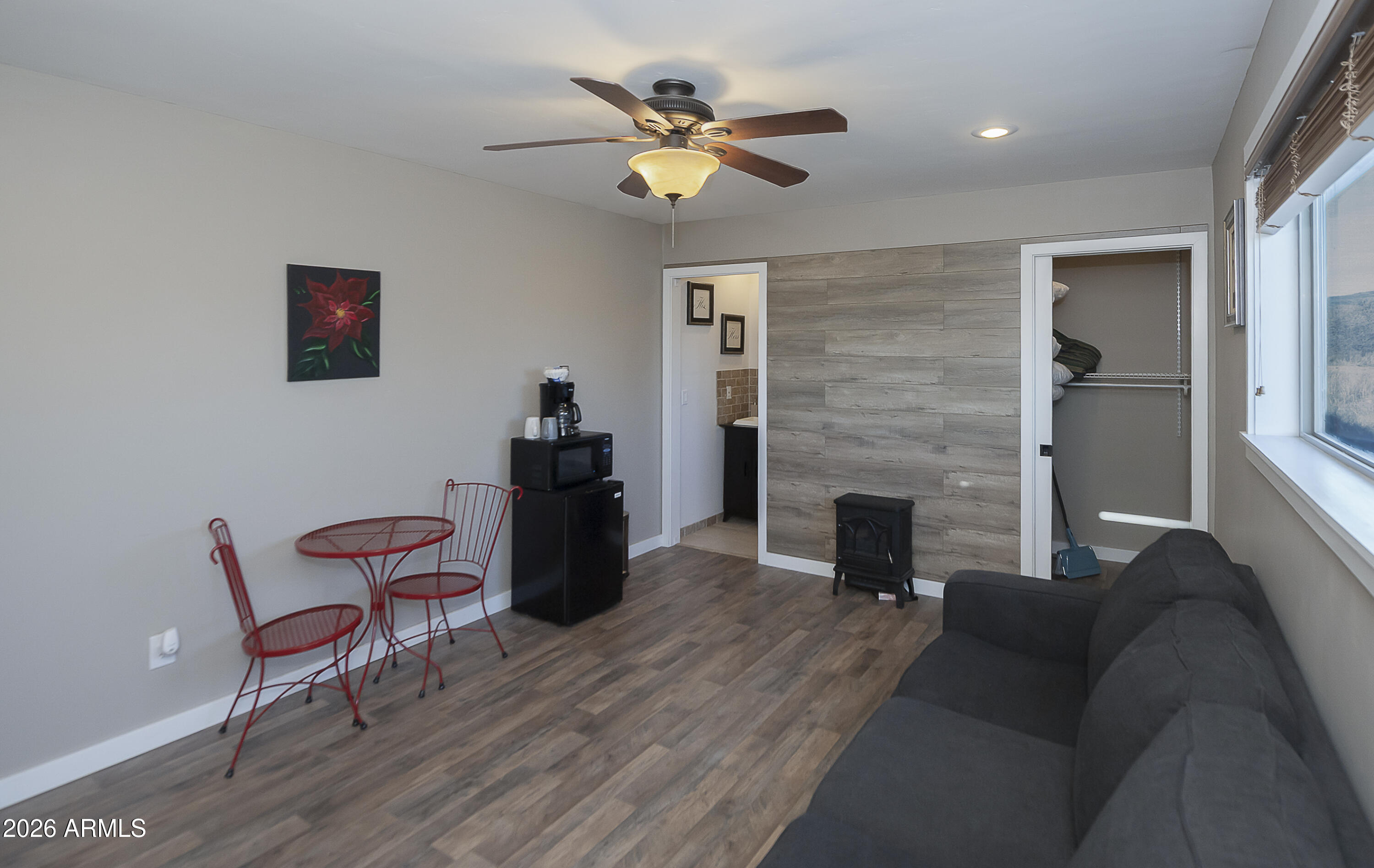 6565 Musgrove Road Skull Valley, AZ 86338 - Photo 53 of 67 a living room with furniture and a fireplace