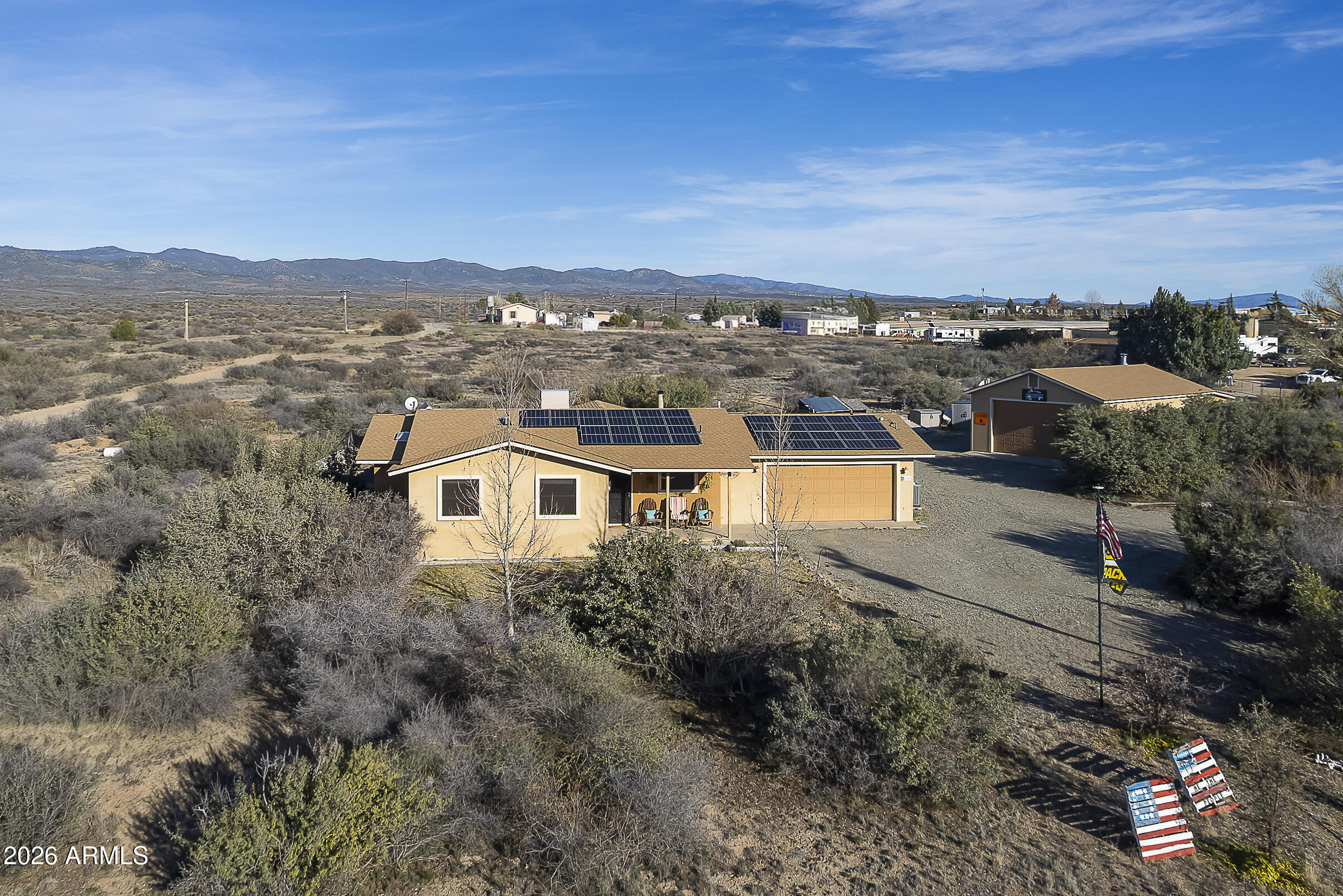 6565 Musgrove Road Skull Valley, AZ 86338 - Photo 59 of 67 an aerial view of residential houses with outdoor space and trees