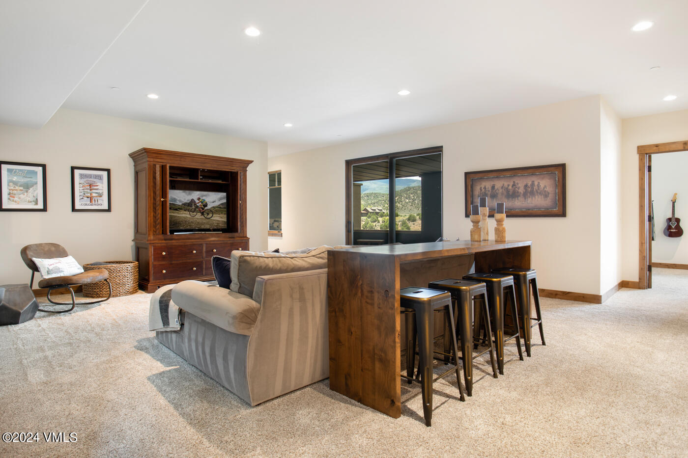 1288 East Haystacker Drive Eagle, CO 81631 - Photo 18 of 34 a living room with furniture and a flat screen tv