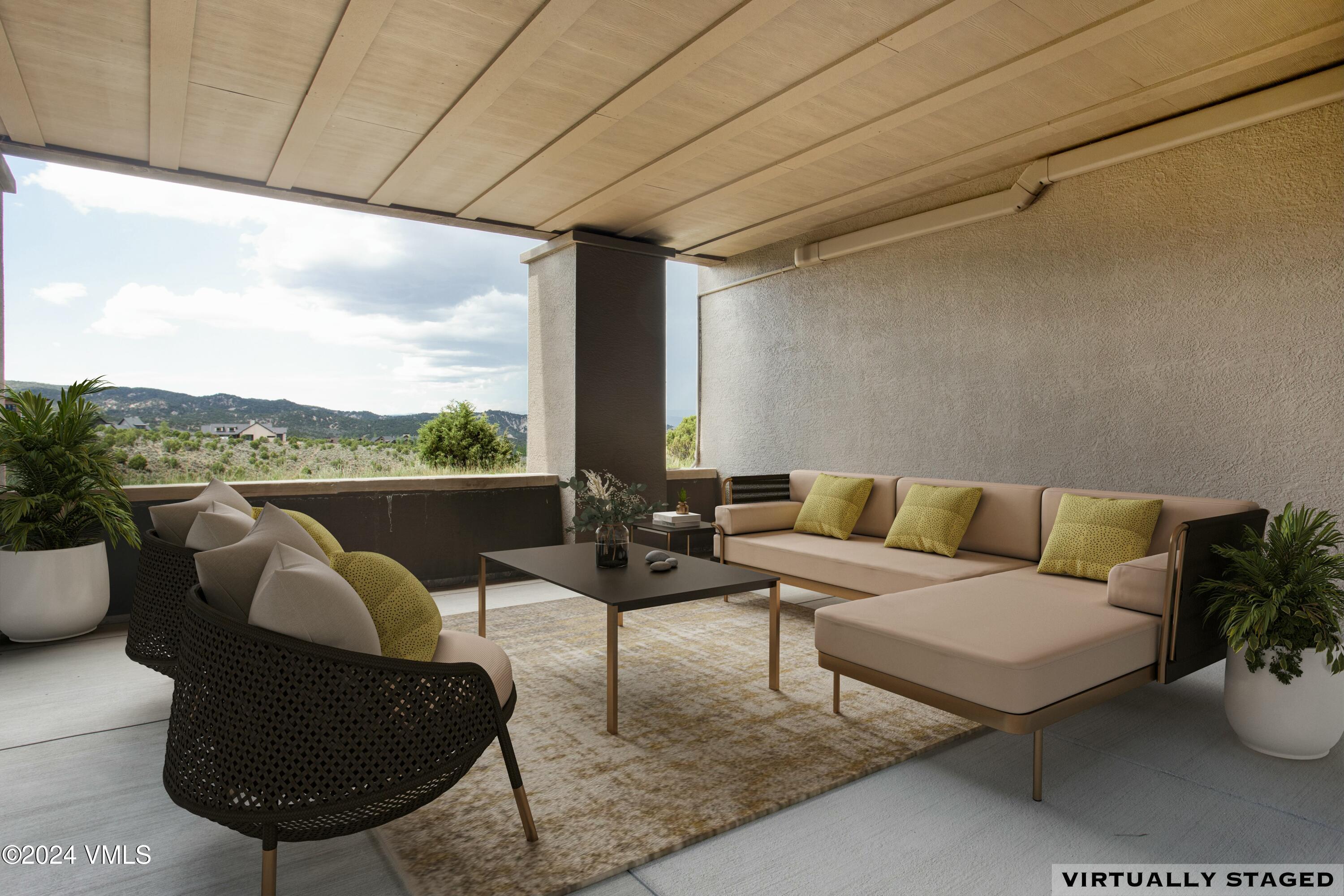 1288 East Haystacker Drive Eagle, CO 81631 - Photo 20 of 34 a living room with furniture a rug and a large window