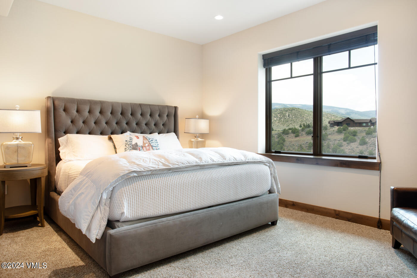 1288 East Haystacker Drive Eagle, CO 81631 - Photo 23 of 34 a bed sitting in a bedroom next to a window