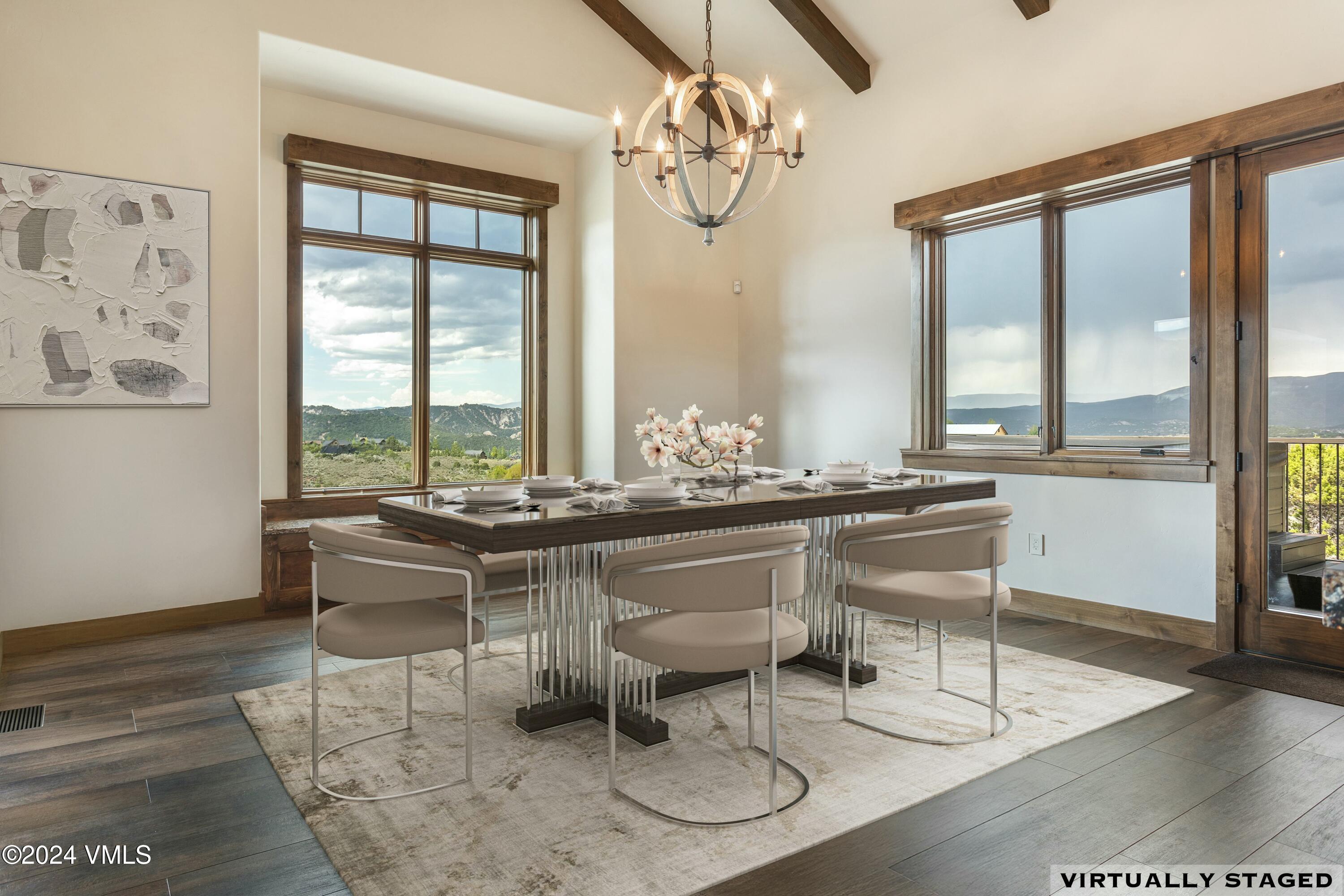 1288 East Haystacker Drive Eagle, CO 81631 - Photo 9 of 34 a room with table chairs and a window