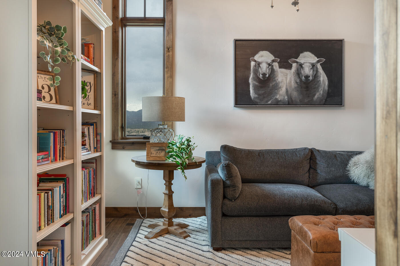 1288 East Haystacker Drive Eagle, CO 81631 - Photo 10 of 34 a living room with furniture and a book shelf