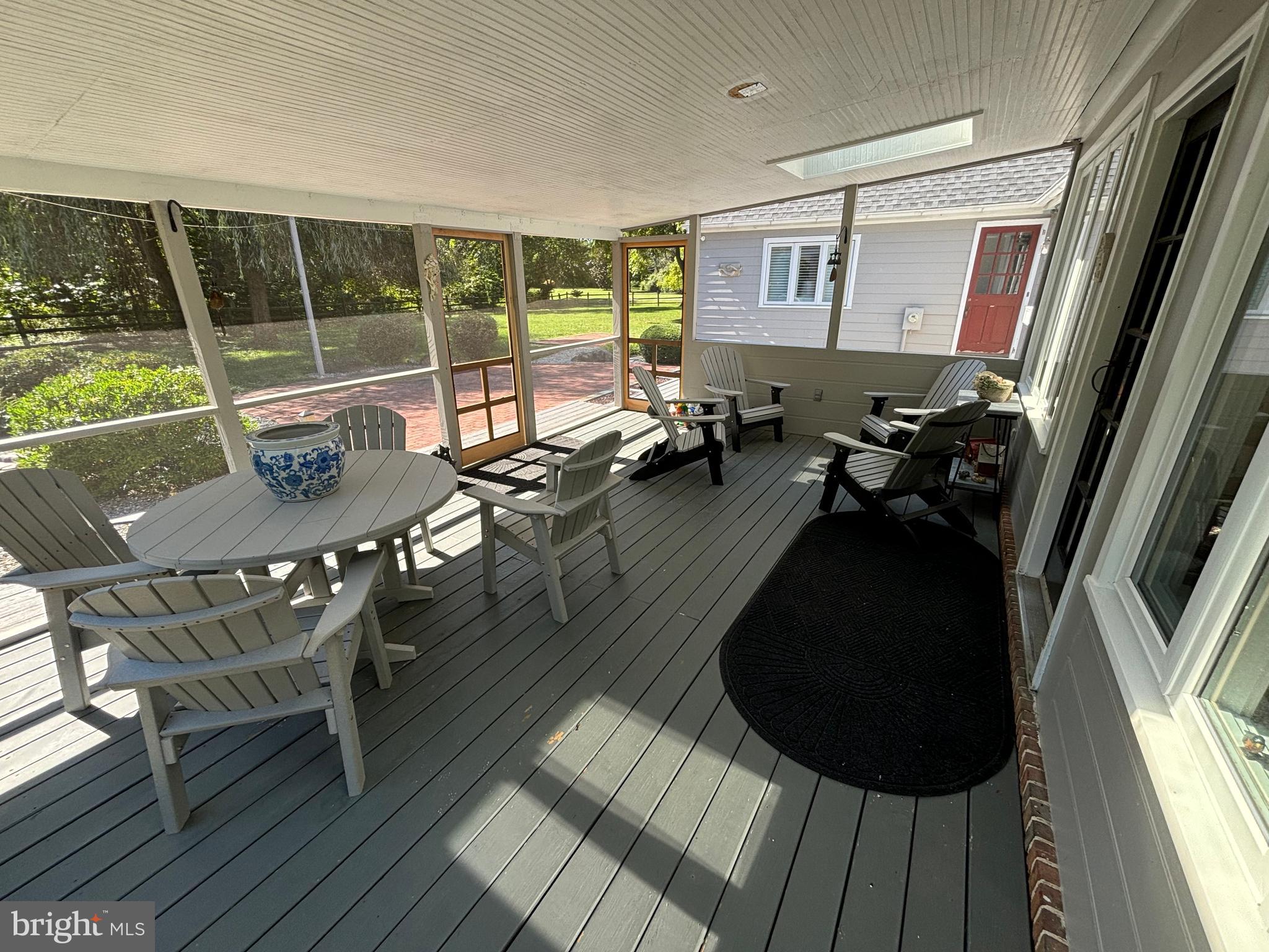 10230 John Carvill Road Chestertown, MD 21620 - Photo 11 of 41 a living room with furniture and a floor to ceiling window
